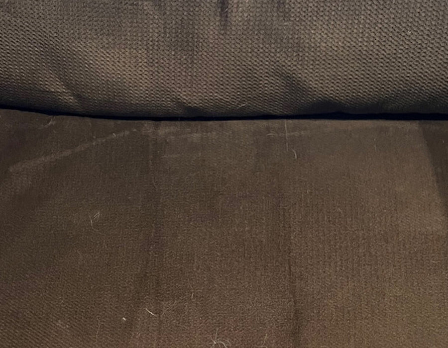 A brown couch cushion that's completely clean, no hair in sight.